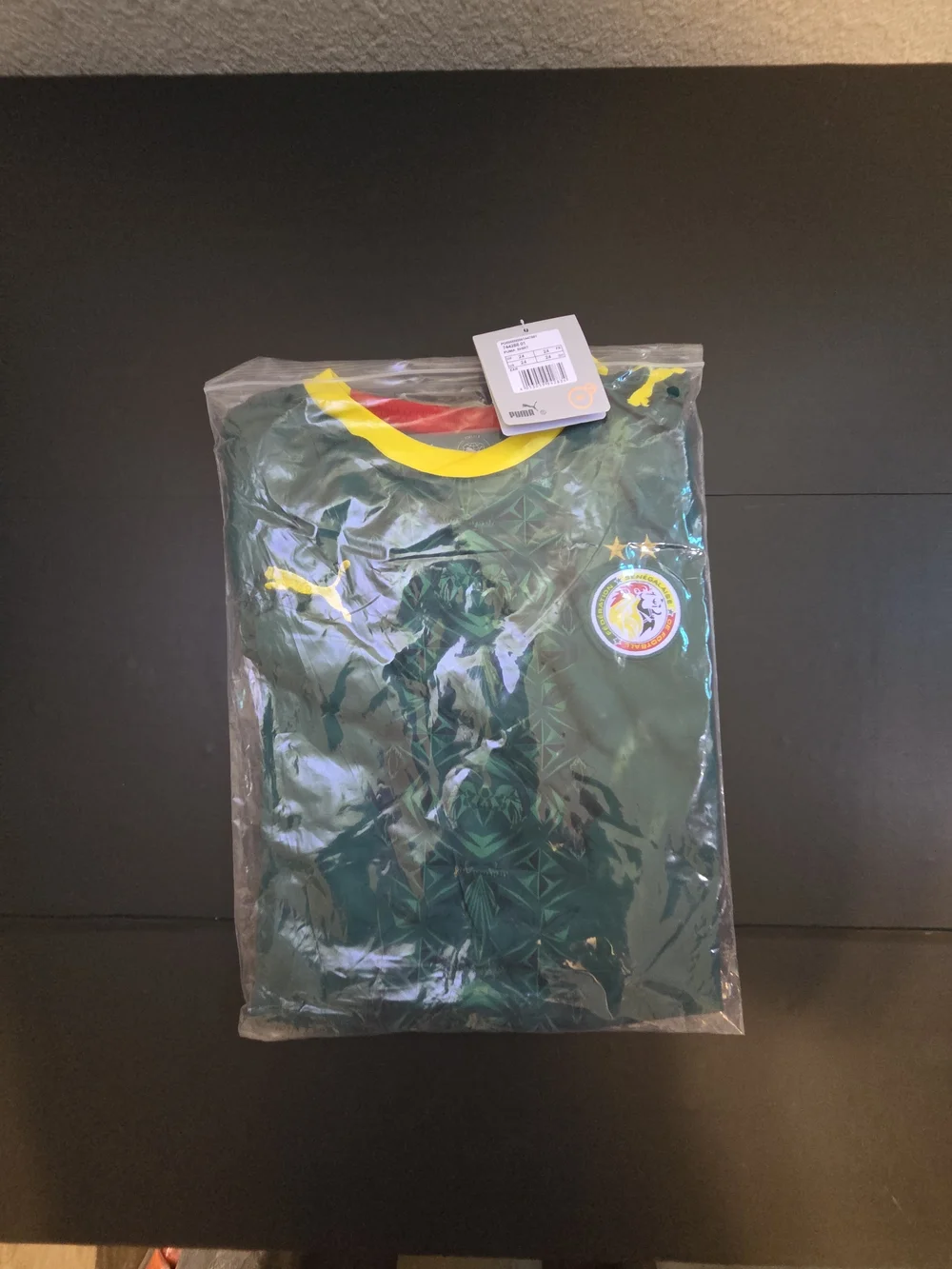 Puma Kids Green Jersey and Shorts Set with Red & Yellow Accents